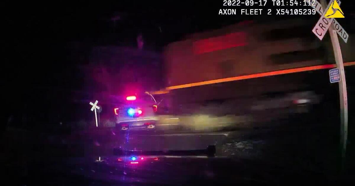 Freight train Slams Into police vehicle parked on tracks with woman handcuffed Inside